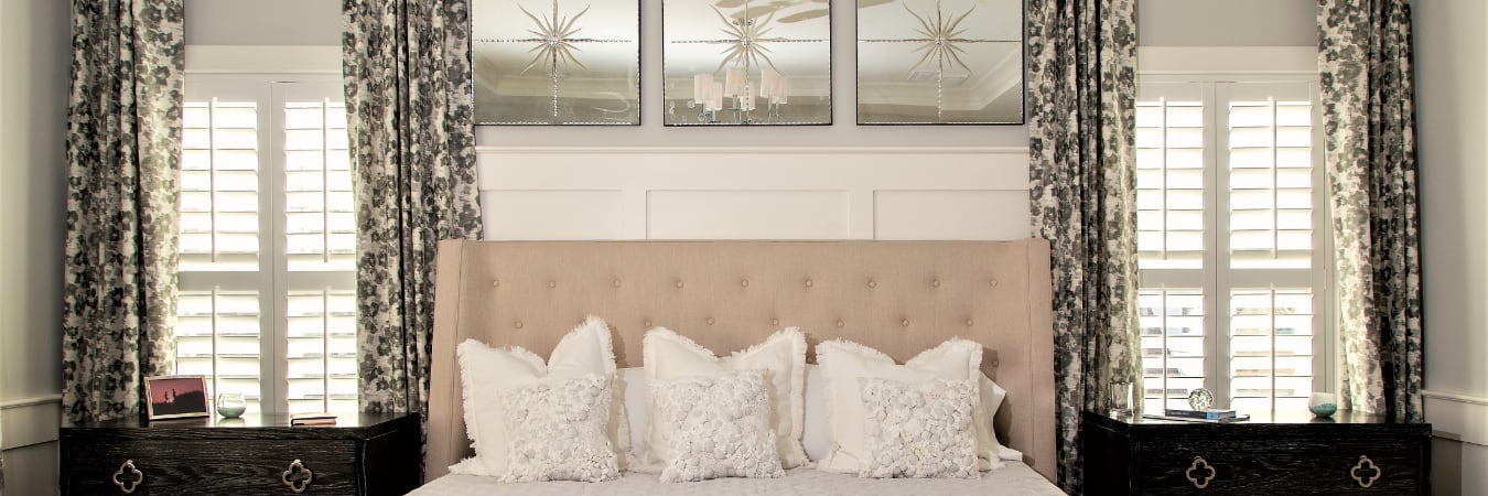 Plantation shutters in a bedroom.